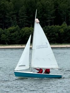 Sailboat on lake with two passengers