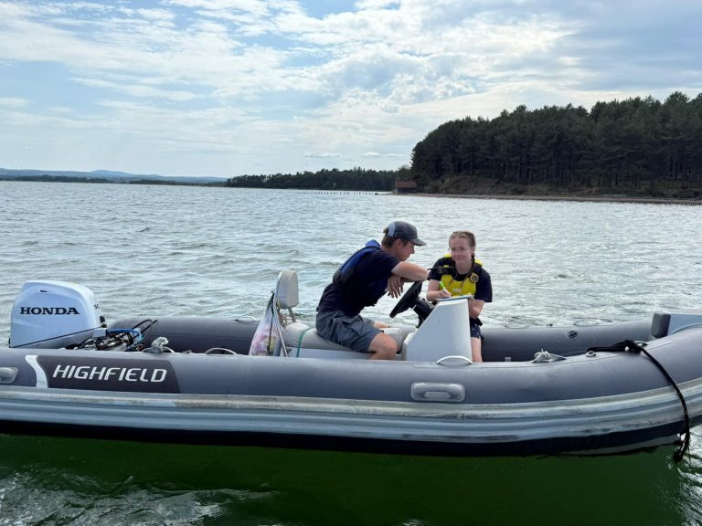 img 20250713 wa0130 Two people chatting on a Honda Highfield boat