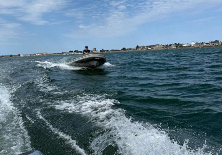 Jet ski speeding on vibrant blue sea